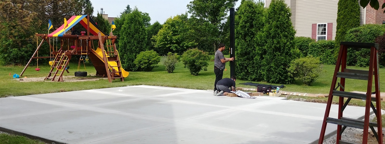 Budget-Friendly Corner Lot Backyard Basketball Court in Menomonee Falls