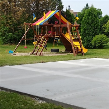 Budget-Friendly Corner Lot Backyard Basketball Court in Menomonee Falls