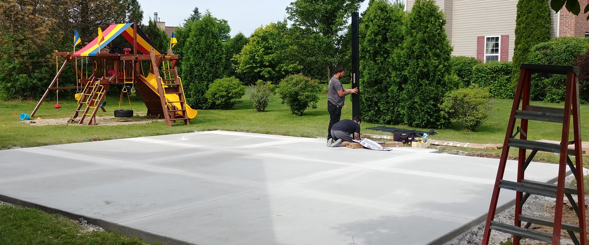 Budget-Friendly Corner Lot Backyard Basketball Court in Menomonee Falls