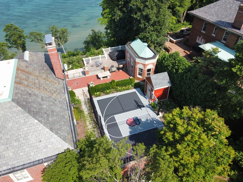 Aerial view of a lakefront roller hockey and basketball court in a Whitefish Bay, WI courtyard